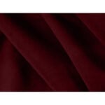 Close-up of the Petal Velvet 1 Seater Modern Sofa in dark maroon, showcasing its soft-textured fabric with gentle folds that create subtle shadows and depth. Explore this luxurious piece and more at Fashable, where quality meets style.