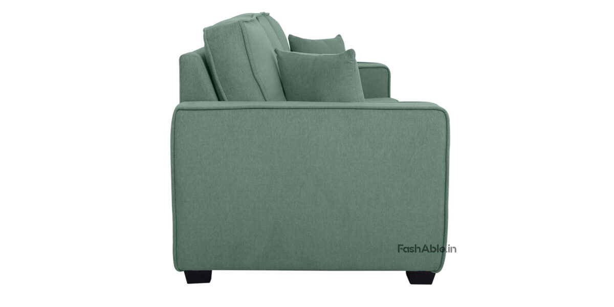 Side view of a Thea 3 Seater Mid-Century Sofa 78 in green upholstery, featuring two large back cushions and two smaller side cushions. Its sleek design with short black legs offers a modern touch, perfect for enhancing your space with Fashable elegance.